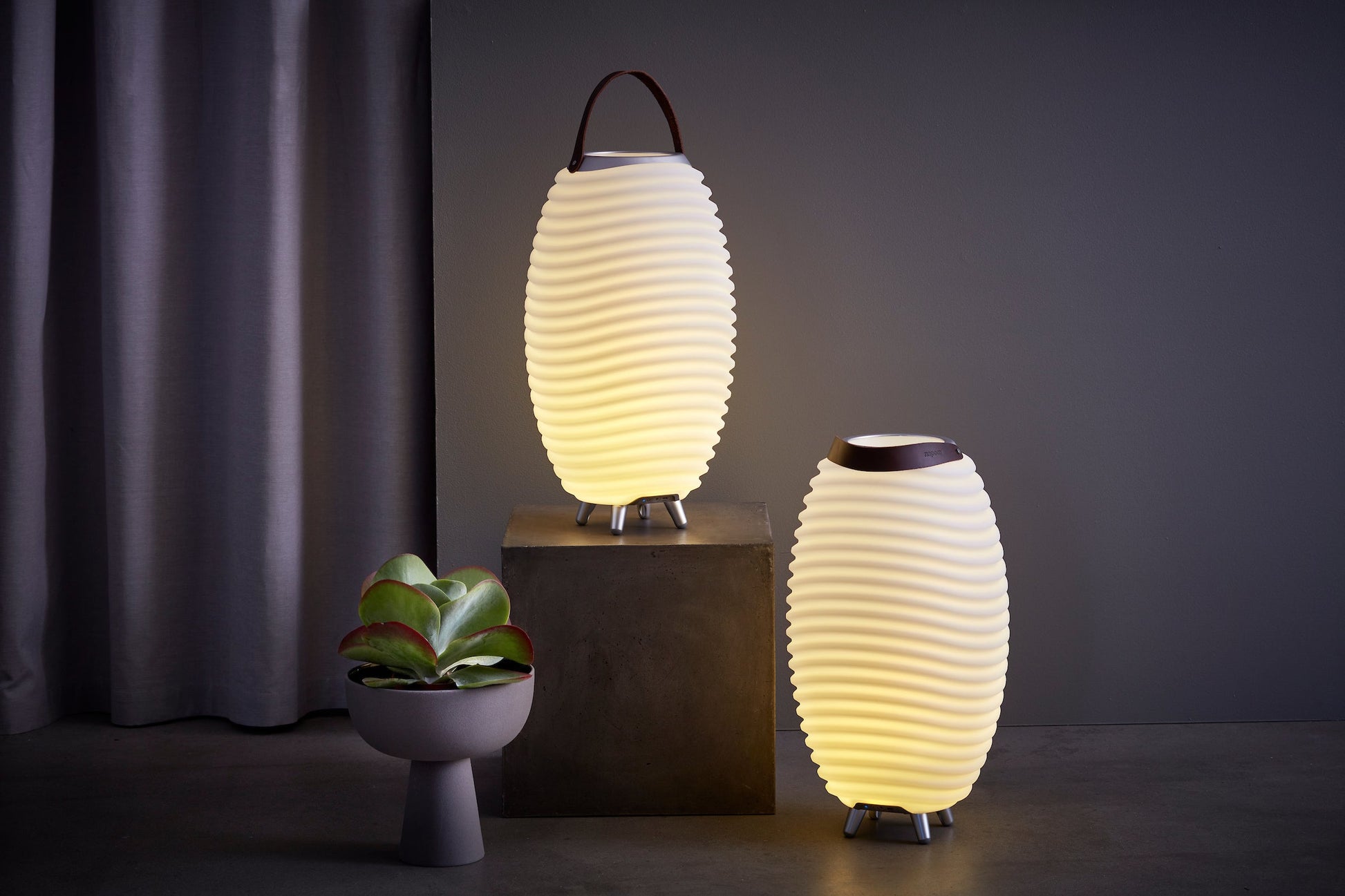 Сomposition of two Kooduu Synergy lamps illuminating a modern dark interior
