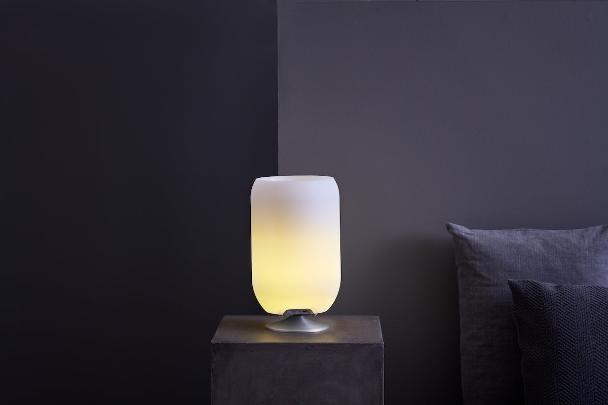 Kooduu Atmos lamp with minimalistic design illuminating a dark interior