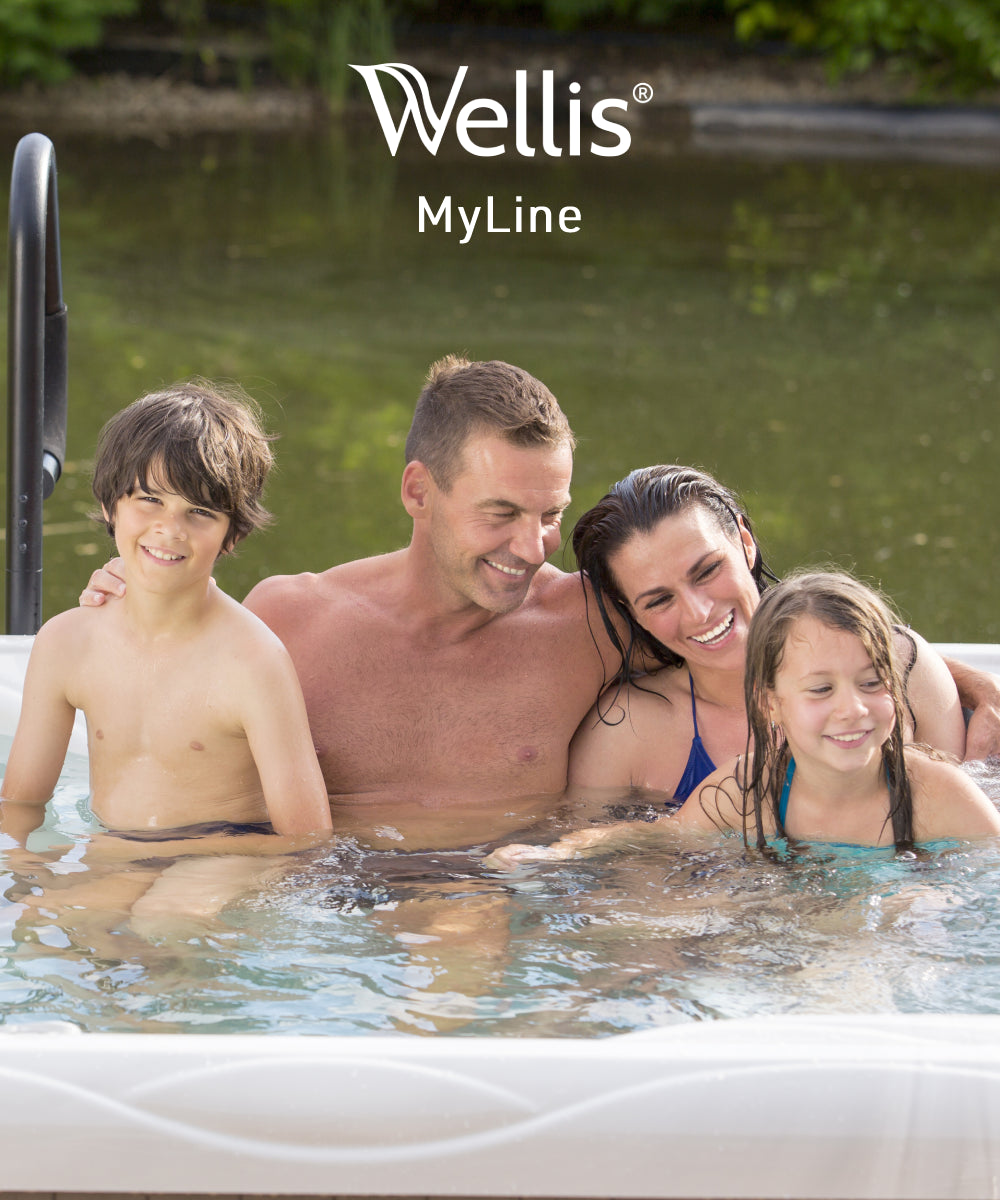 Family with two children having a joyful time in a spa bath